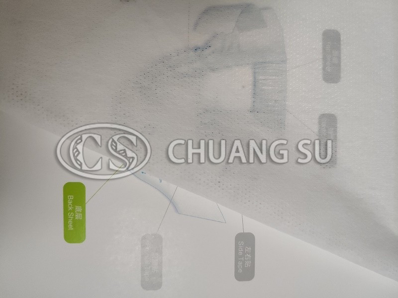 Perforated and embossed nonwoven fabric - perforated bottom layer